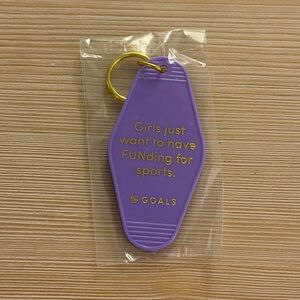 Purple Keychain with Gold Text “Girls just want to have FUNding for sports”